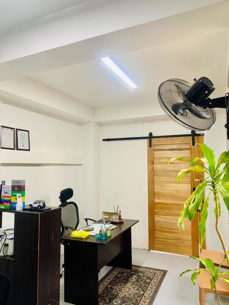Office interior with a desk and wooden sliding door
